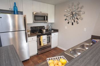 Kitchen with stainless steel appliances  l The Edge Apartments in Davis, CA